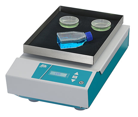 a bottle of liquid sits on top of a shaker machine that says 185